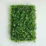 Artificial green wall decor with ferns and flowers