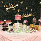 Dessert table with cakes, cupcakes, and sweets for a themed celebration.