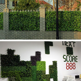 Artificial green wall panels for decoration and privacy.