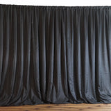 Black satin curtain draped elegantly, adding a touch of sophistication to any space.