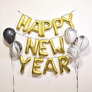 Gold "Happy New Year" balloons with marbled black and white balloons