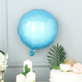 Blue balloon decoration against a gray backdrop.