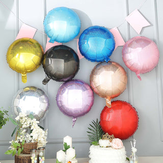 Colorful metallic balloons displayed on a wall for a festive celebration.