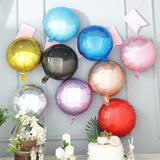 Colorful metallic balloons in various shades arranged on a decorative wall.