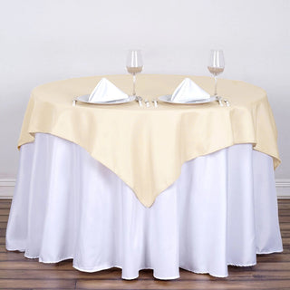 Elevate Your Event with the 54x54 Beige Square Seamless Polyester Table Overlay