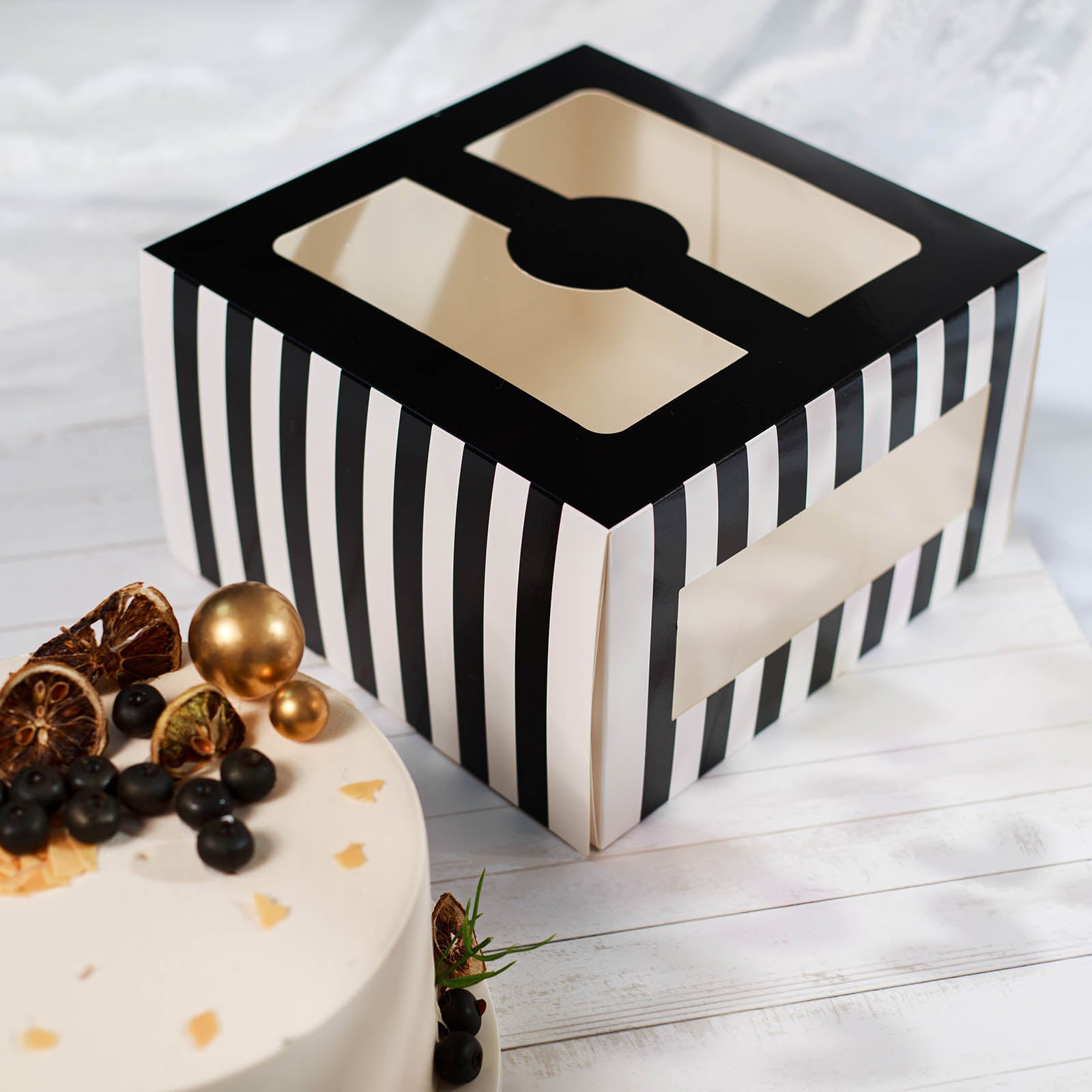 https://tableclothsfactory.com/cdn/shop/products/Black-White-Striped-Bakery-Cardboard-Cake-Boxes.jpg?v=1689407911