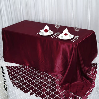 Add Elegance to Your Event with the Burgundy Satin Seamless Rectangular Tablecloth