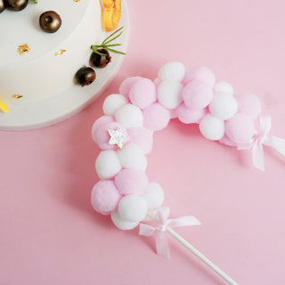 Create a Festive Atmosphere with the Pink/White Cotton Ball Arch Cake Topper