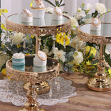 Elegant gold dessert stands with mirror tops and crystal accents, styled with cupcakes.