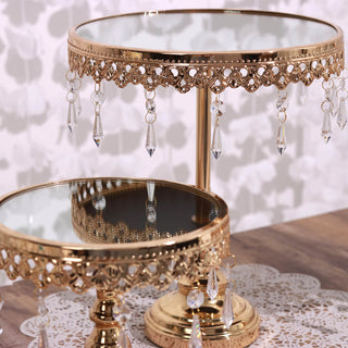 Elegant gold cake stand with hanging crystals and mirror top.
