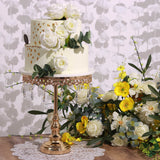 Elegant floral wedding cake adorned with roses and golden accents.