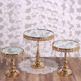 Elegant gold display stands with crystal accents and mirrored tops.