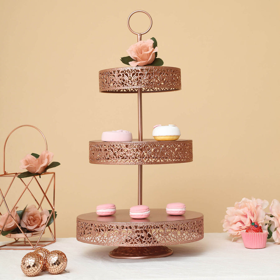 Rose gold three-tier cake stand with macarons and floral accents