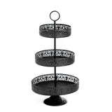 Black three-tiered serving stand with intricate lace design.