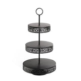 Black three-tiered serving stand with decorative filigree design. #whtbkgd