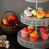 Colorful cupcakes and pastries on a decorative cake stand.