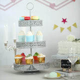 Three-tiered cupcake stand with colorful cupcakes in a festive setting.