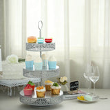 Tiered dessert stand with colorful cupcakes and macarons in a bright setting.
