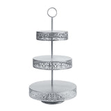 Three-tiered silver cake stand with intricate lace design #whtbkgd
