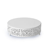 White round coffee table with intricate cutout design and smooth top
