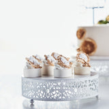 Elegant dessert display with decorated cupcakes on a decorative stand.