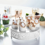 Decorative dessert display with elegant treats and cupcakes on a white cake stand.