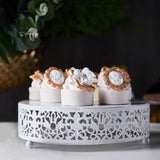 Elegant dessert display on a decorative white stand with intricate details.