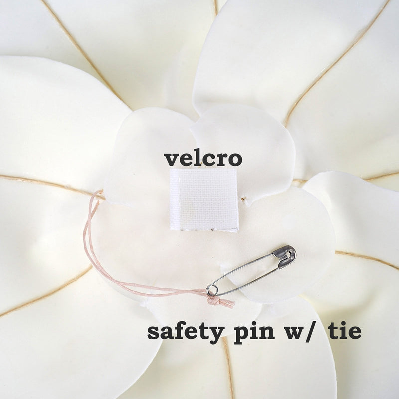 White flower petals with velcro and safety pin attachment