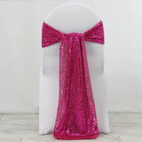 Pink sequin chair sash draped elegantly on a white chair.
