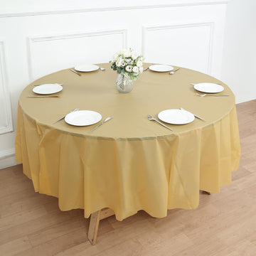 84" Gold Waterproof Plastic Tablecloth, PVC Round Disposable Table Cover