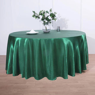 Add Elegance to Your Event with the 120" Hunter Emerald Green Seamless Satin Round Tablecloth