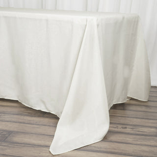 Elevate Your Event with the Ivory Seamless Polyester Rectangle Tablecloth