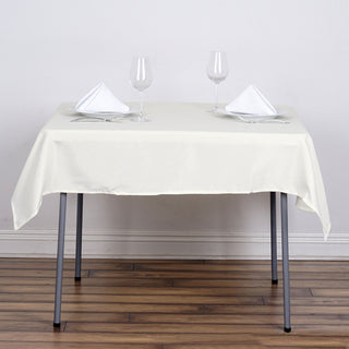 Elevate Your Event Decor with the 54x54 Ivory Square Seamless Polyester Tablecloth