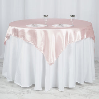 Enhance Your Event Decor with the 60"x60" Blush Square Smooth Satin Table Overlay