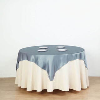 Add a Touch of Sophistication with the Dusty Blue Square Smooth Satin Table Overlay