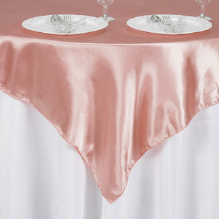 Create a Luxurious Atmosphere with the 60"x60" Dusty Rose Square Smooth Satin Table Overlay