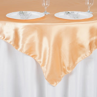 Durable and Gorgeous: The Peach Square Smooth Satin Table Overlay