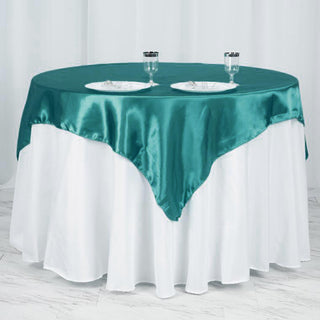 Add a Touch of Elegance with the Turquoise Square Satin Table Overlay