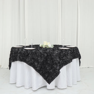 Elevate Your Table Decor with the Black 3D Rosette Satin Square Table Overlay