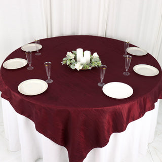 Elevate Your Event Tables with a Burgundy Accordion Crinkle Taffeta Table Overlay