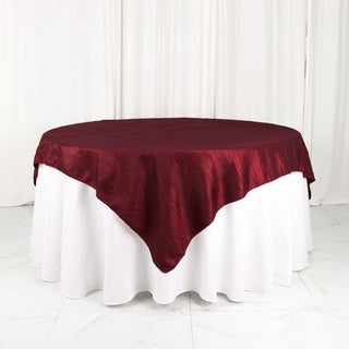 Add Elegance to Your Tablescape with a Burgundy Accordion Crinkle Taffeta Table Overlay