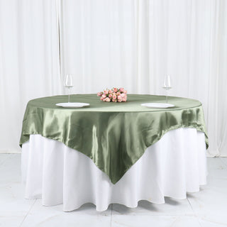 Elevate Your Event with the Dusty Sage Green Seamless Satin Square Table Overlay