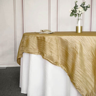 Enhance Your Event Decor with the Gold Accordion Crinkle Taffeta Square Table Overlay