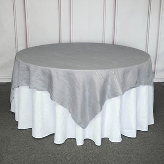 Add Elegance to Your Event with the Silver Accordion Crinkle Taffeta Square Table Overlay