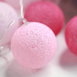 Add a Warm Glow to Any Event with the 13ft Pink Cotton Ball Battery Operated 20 LED String Light Garland