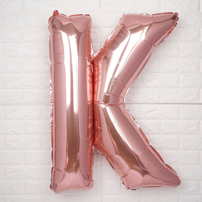 Rose gold foil letter K balloon