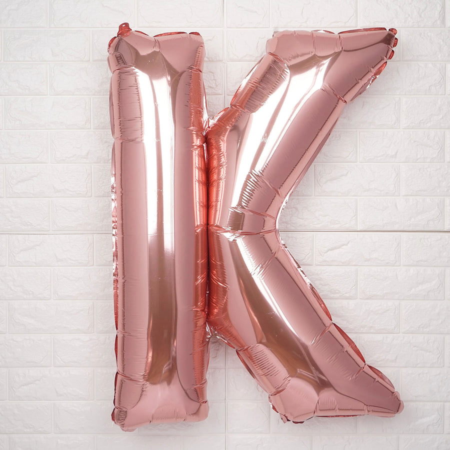 Rose gold foil letter K balloon