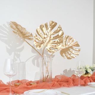 Create a Shimmering Tropical Paradise with Metallic Gold Monstera Leaf Sprays