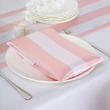 Pink striped table napkin on a white plate
