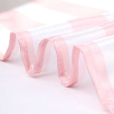 Pink striped sheer fabric with a flowing drape.